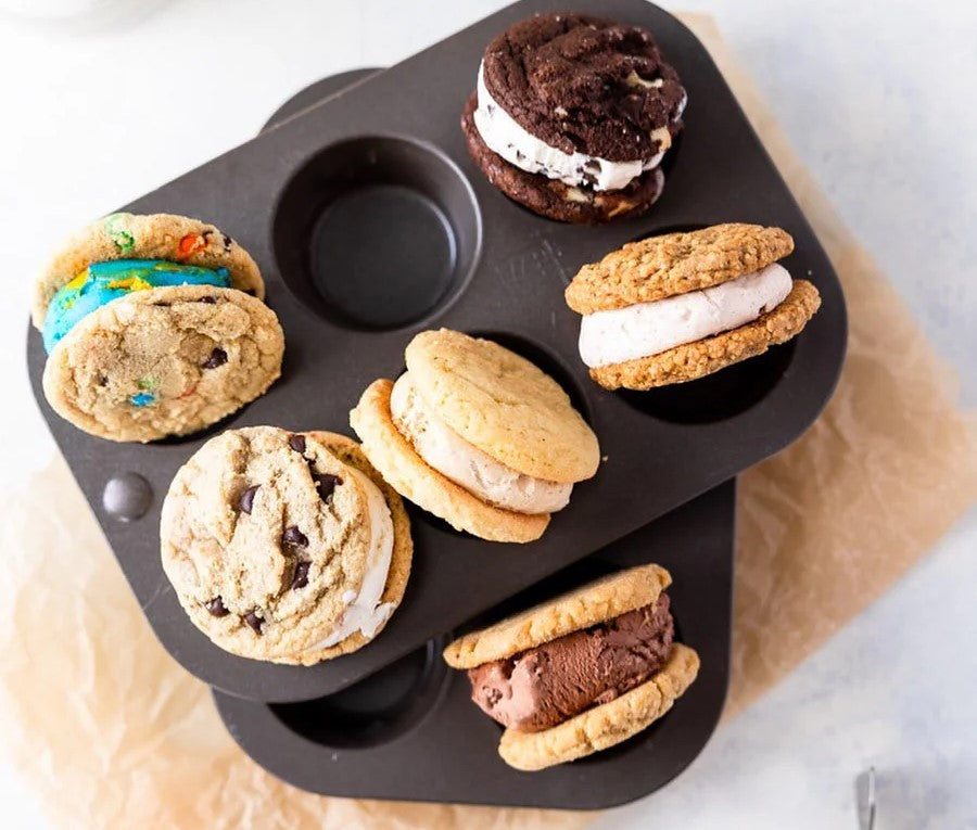 A variety of Cool Jacks ice cream cookie sandwiches arranged in a muffin tin tray.