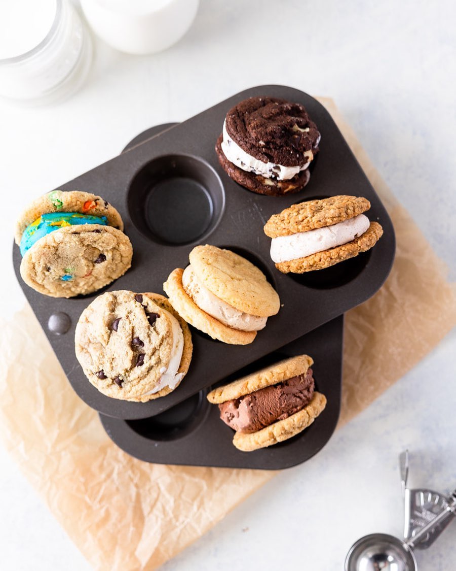 Cool Jacks ice cream sandwiches arranged in a muffin tin with colorful cookies and creamy ice cream centers.
